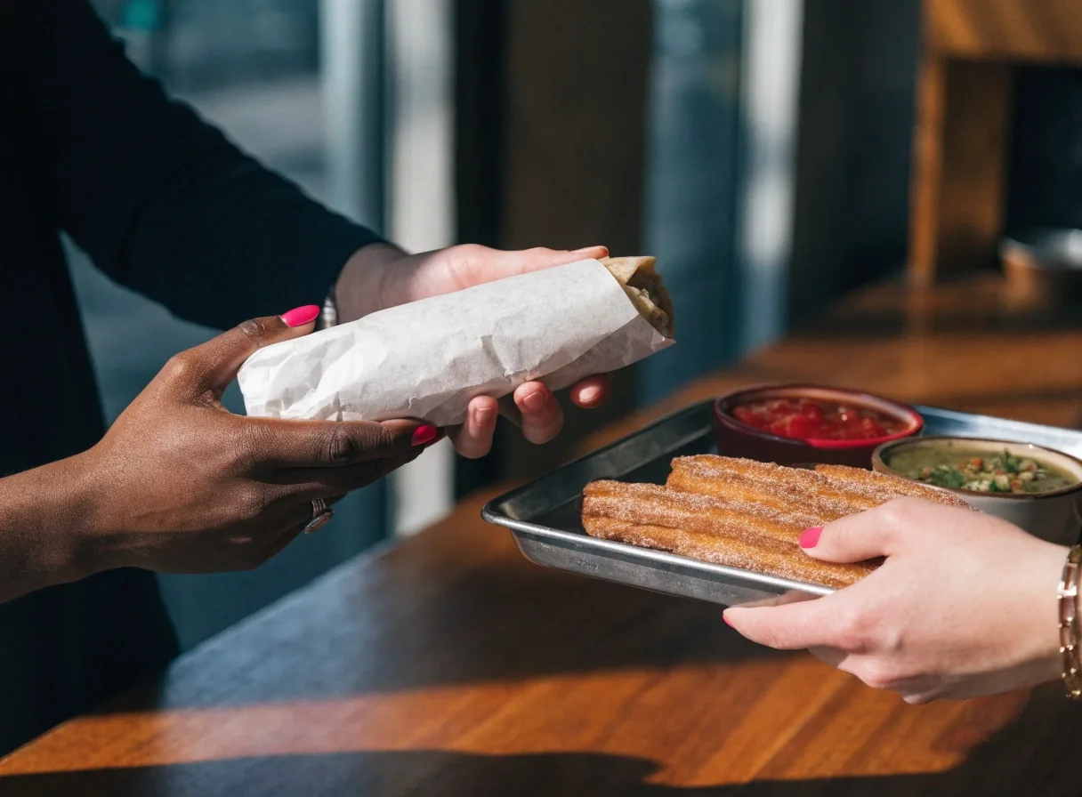 Wrapped burrito ready for pickup with fresh salsas